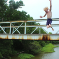 dirty blonde boy jumping off bridge
